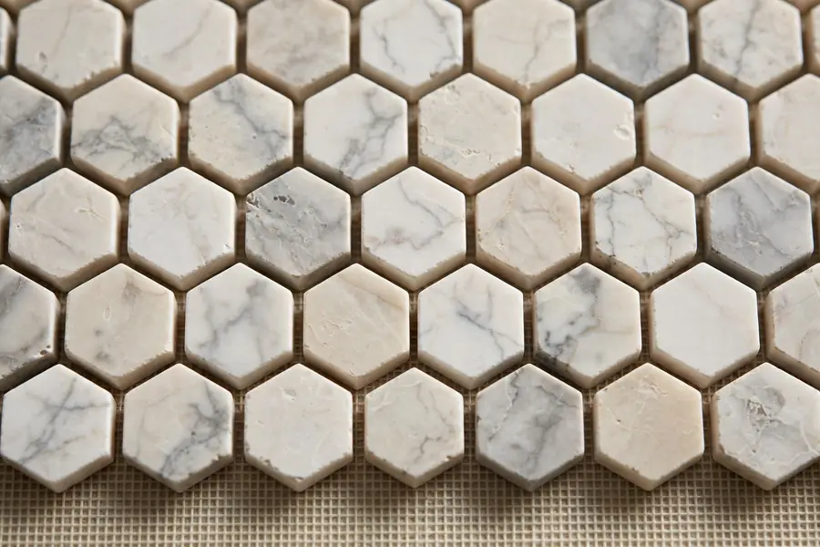 Hexagonal marble-look mosaic tile sheet for bathroom floors and walls in Pakistan