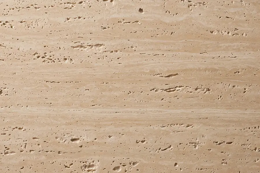 Travertine-look porcelain tile in warm beige for bathrooms and outdoor areas in Pakistan